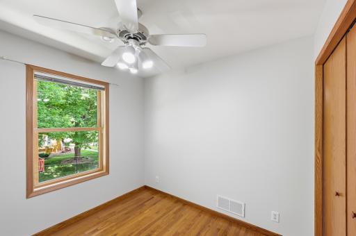 Second upstairs bedroom with hardwood floors.