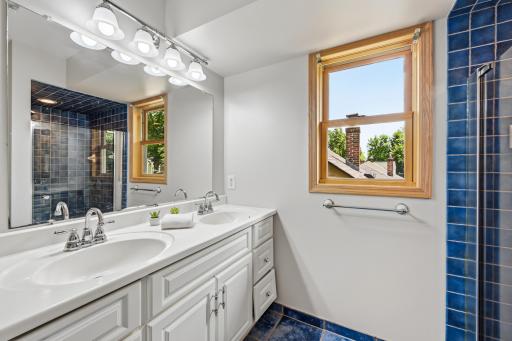 A dual vanity and spacious walk-in shower make getting ready a pleasure.
