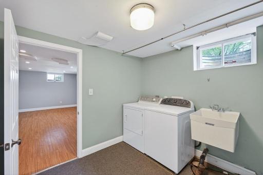 Laundry room in basement with utility sink.