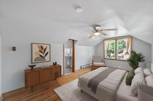 Upper level primary suite has adjoining 1/2 bath.