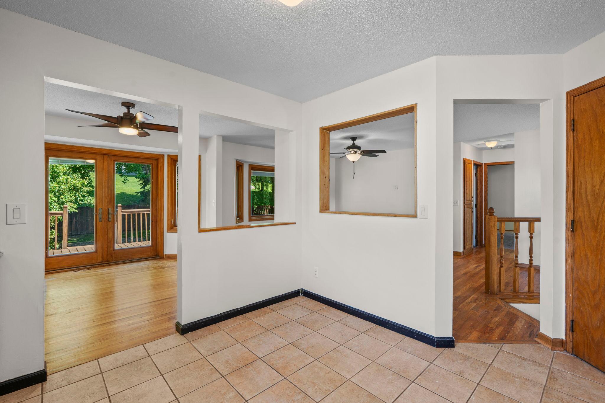 Kitchen view into dining room and living room
