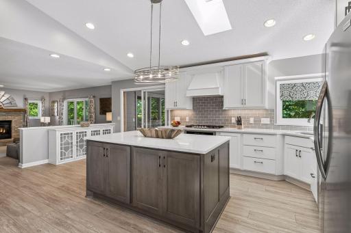 The oversized kitchen island makes for a perfect spot to prep food, bake, and entertain