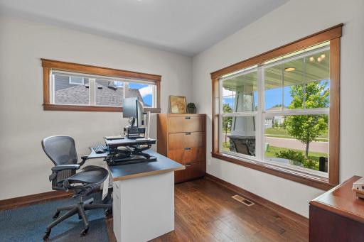 The well-lit main floor office space with solid wood french doors is perfect for an in-home office or for personal use.