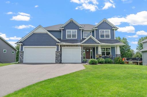 This well designed two-story walk-out 5 bed, 5 bath home with a dedicated office has quality craftsmanship and timeless architectural appeal. An indoor Sport Court and two primary suites are some of the many standout features of this home.