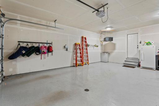 The over-sized 3-car garage in insulated and heated. It also has an epoxy-coated floor and floor drain. The value of a garage floor drain shouldn't be underestimated with all of the snow and slush we carry in during MN winters.