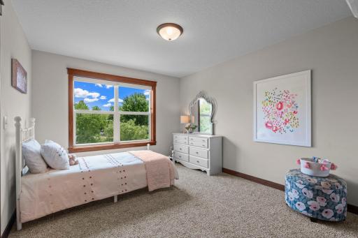 This is the third bedroom and the first of two bedrooms that adjoin a bathroom, otherwise referred to as the "Jill" of the "Jack-and-Jill" suite. Also with a walk-in closet.