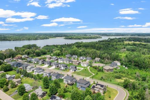 This home is located on an extra wide U shaped street in close proximity to Peltier Lake. There is very little traffic on the street beyond the resisdents. There is no home directly across the street due to the walking path and wetland area.