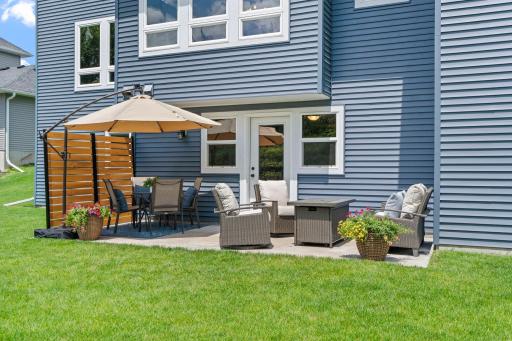 The walk-out lower level leads to a spacious patio designed for relaxing and entertaining.