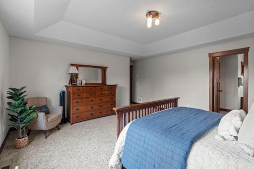 The tray ceilings bring a high-end, expansive feel to the room.