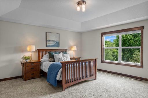 The large primary bedroom offers plenty of room to set up the perfect in-home retreat.