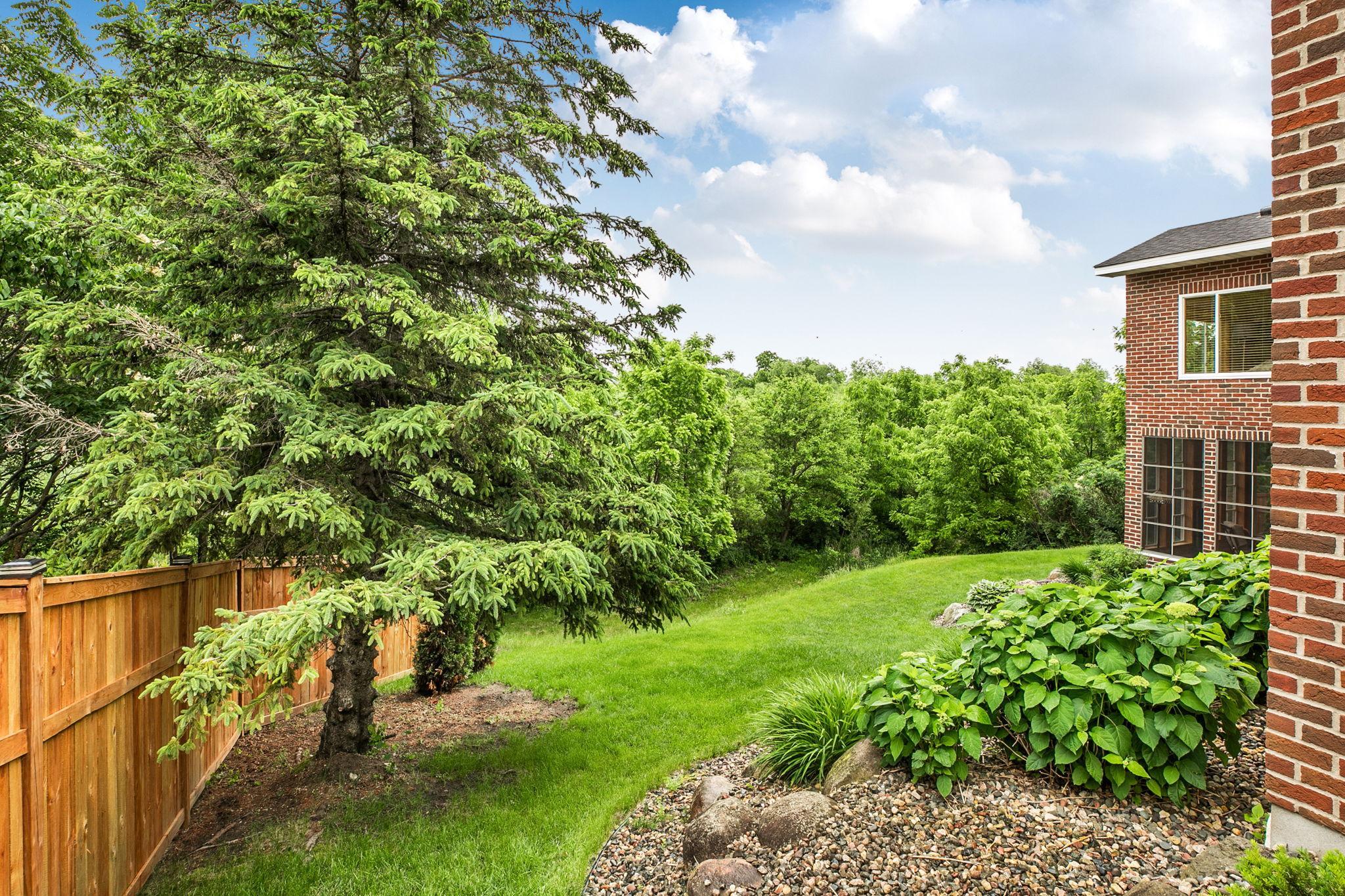 Beautifully landscaped around the entire property with privacy fences added in 2026 on both sides of the home