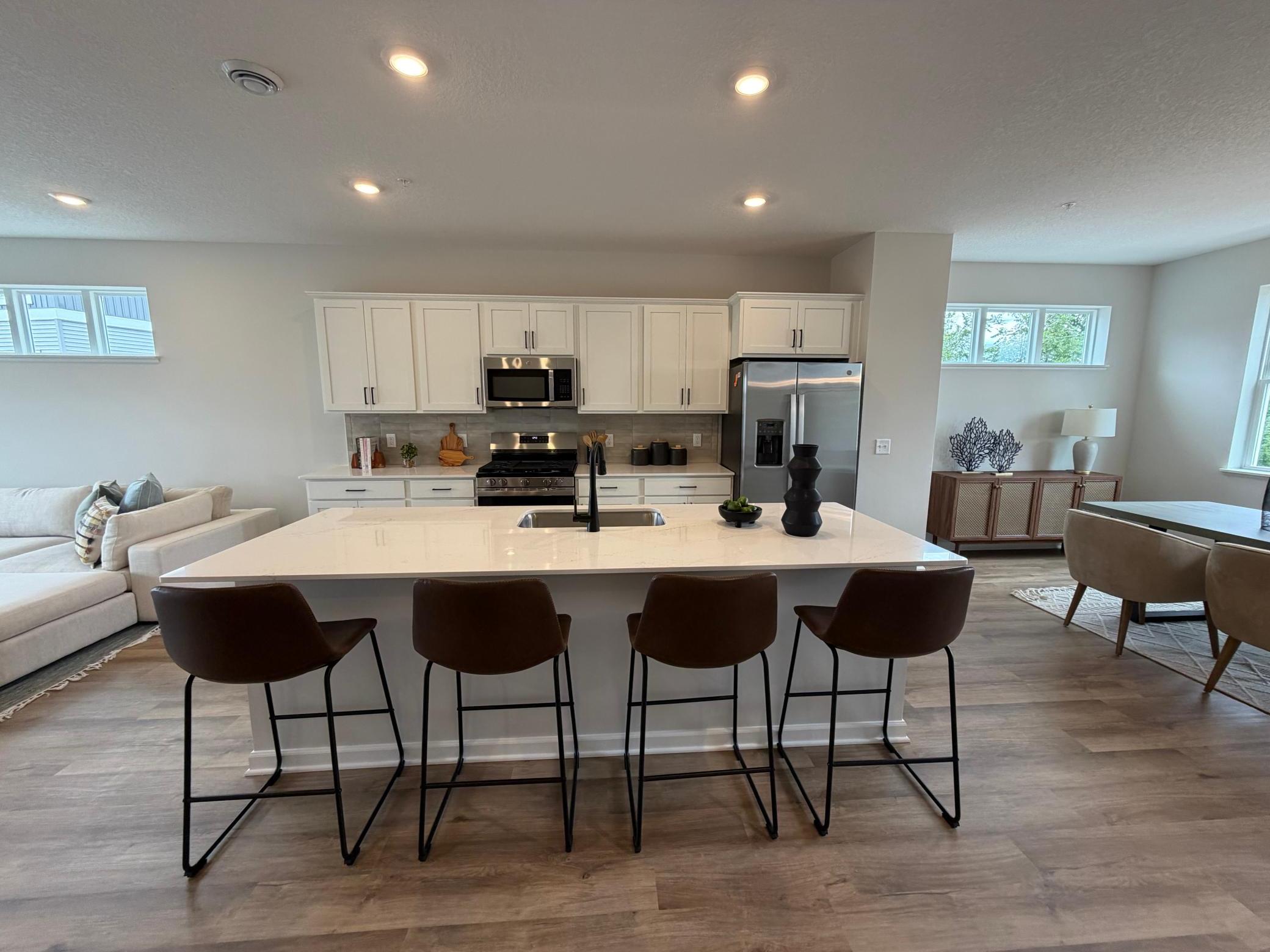 Welcome to the Capri! This home’s kitchen features an oversized island and all the kitchen appliances. With plenty of seating for those on the go for the early mornings!