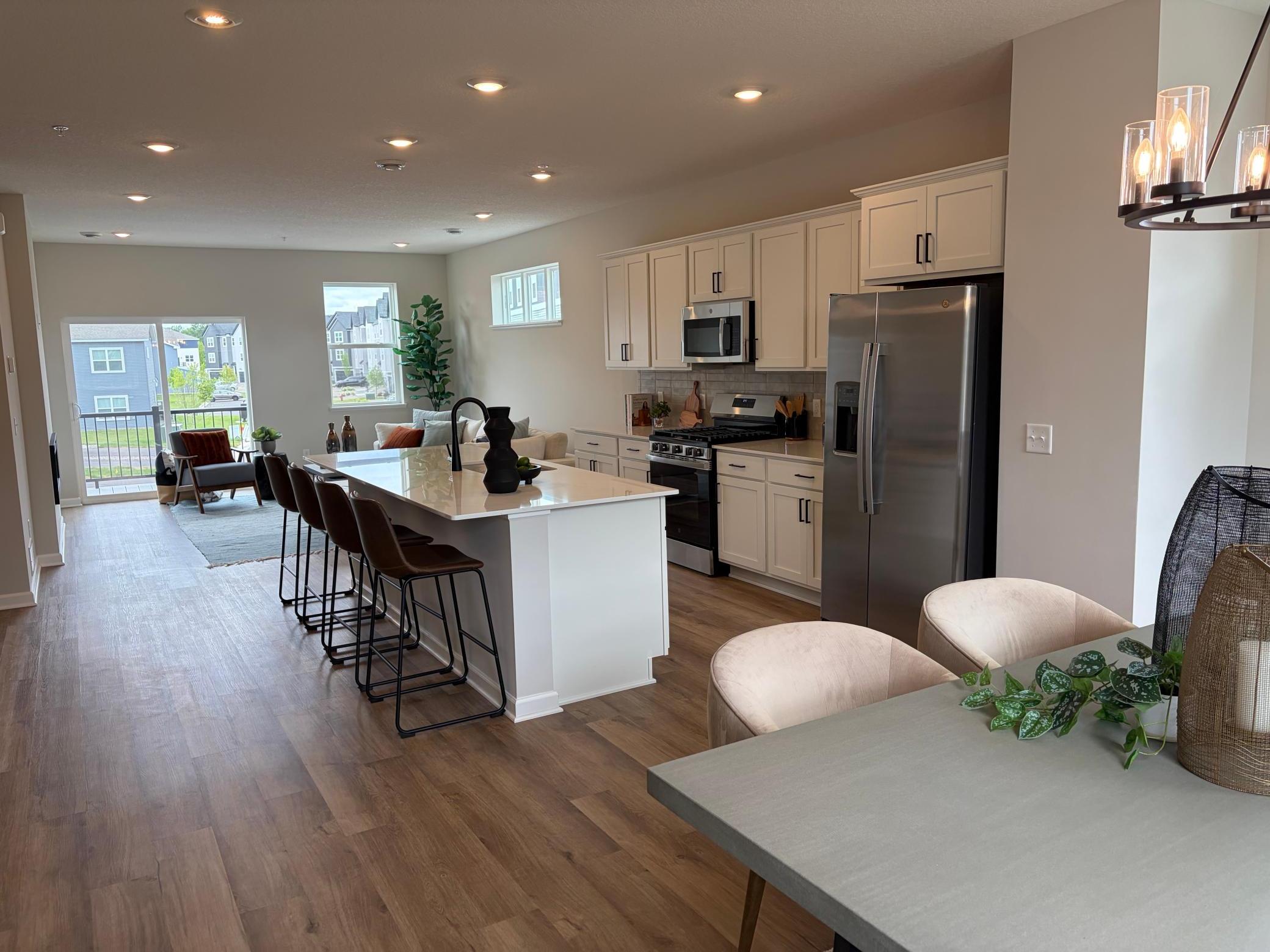 In this open floor plan, the dinette, kitchen, and living room flow flawlessly to keep everyone connected.
