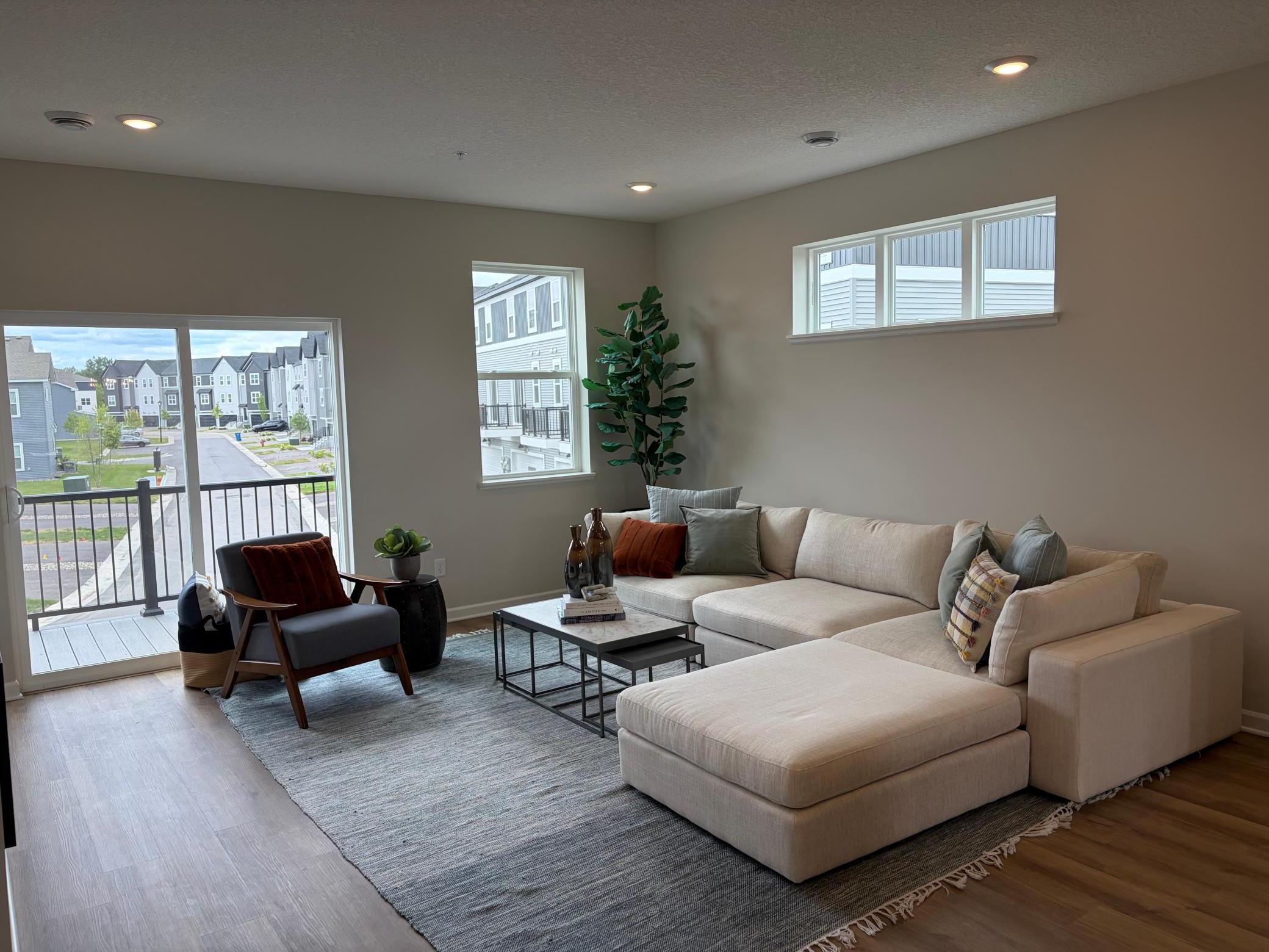 A reverse look at the living room shows even more windows for excellent lighting.