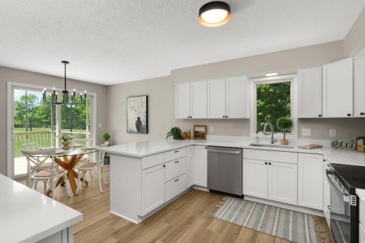 Updated Kitchen with new countertops, appliances, cabinets, flooring and lighting