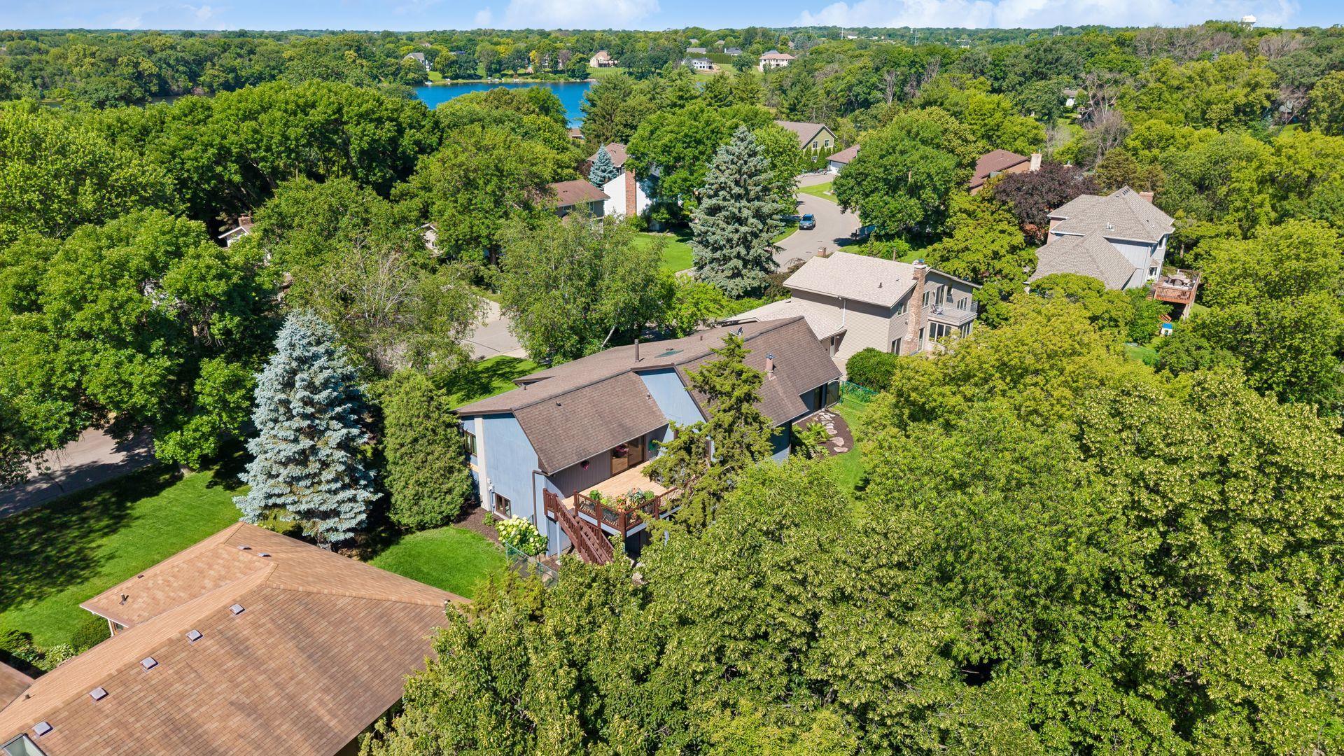 Rear view of home from the sky, with Mitchell Lake in the background. Mitchell Lake has a few channels or "arms" of the lake, please see map. 7966 Island Rd is on the north channel.