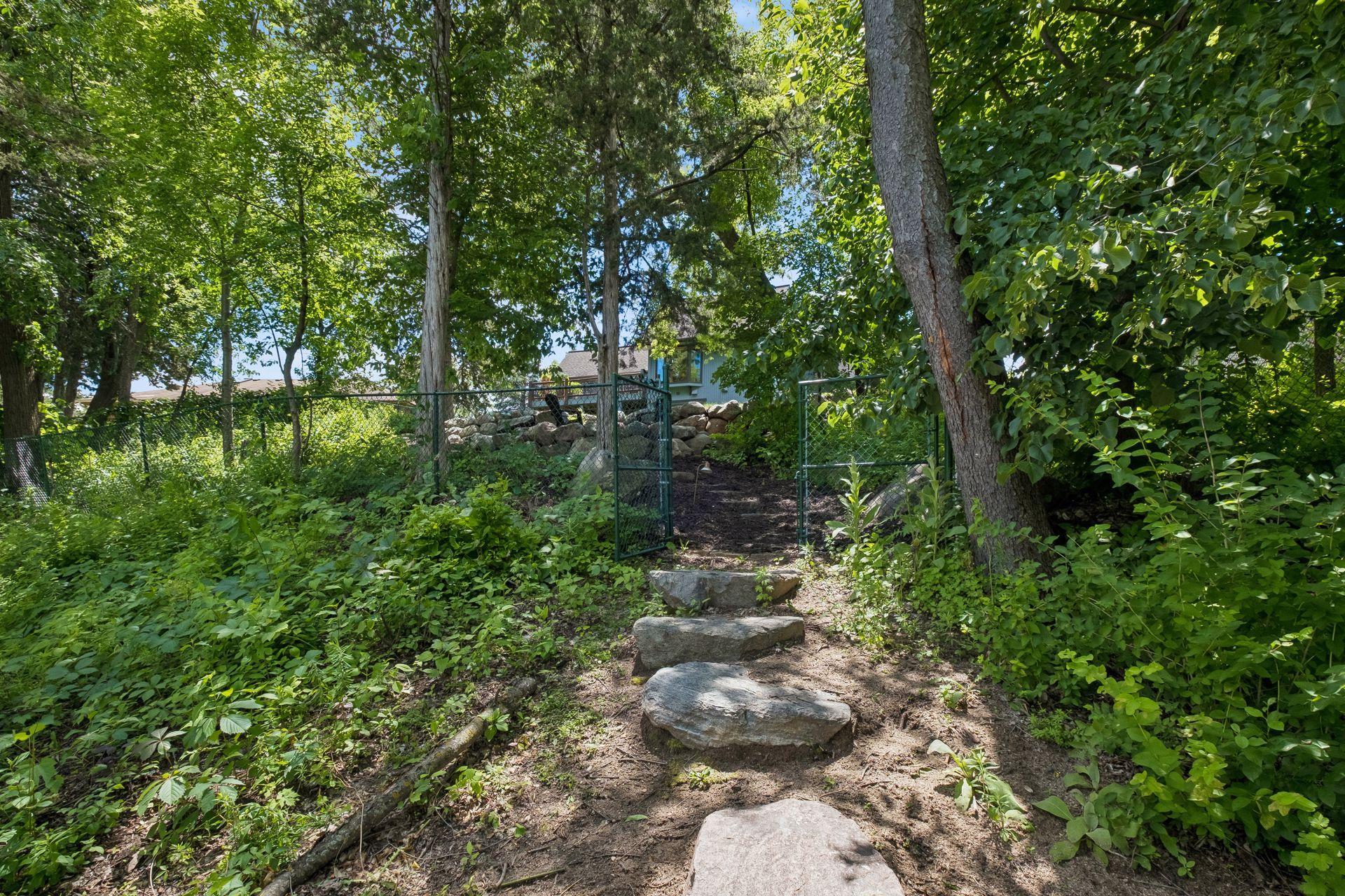 From the dock, stone pathway leads up to the house.