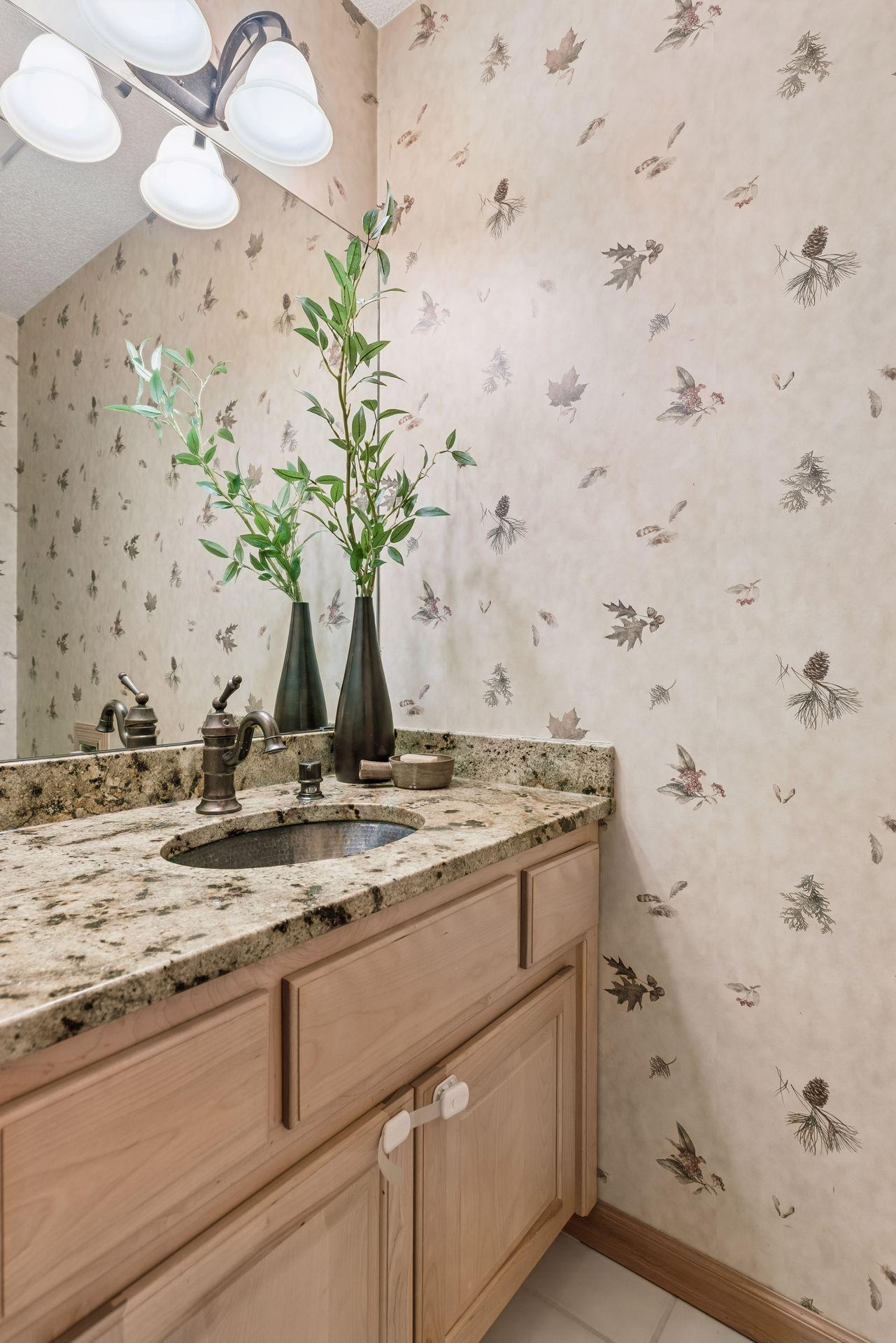 Main floor powder room for guests with a North Woods motif.