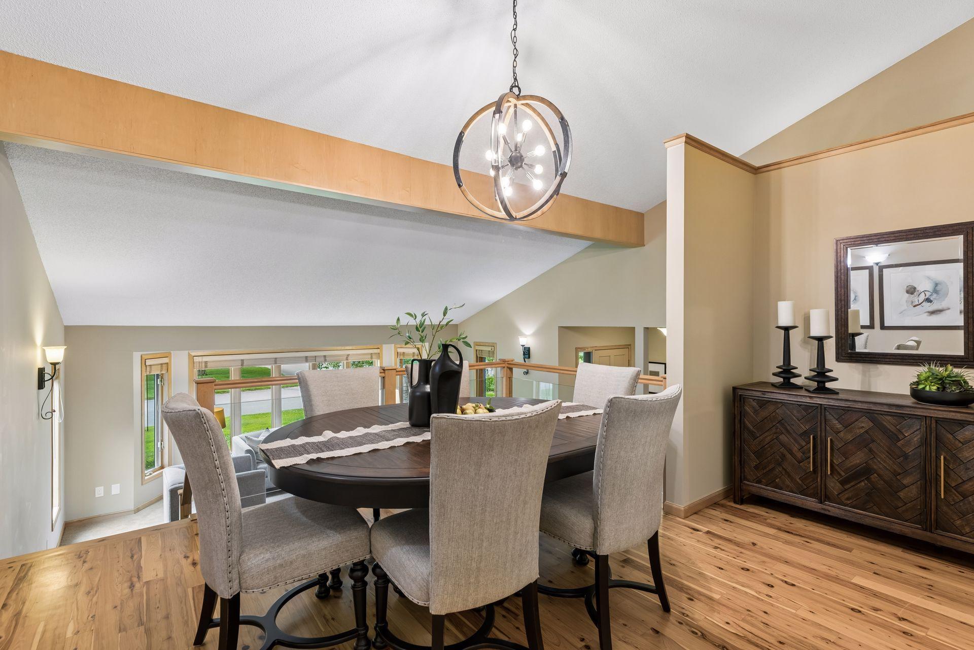 Second dining room area overlooks the living room, with alcove for hutch or storage.