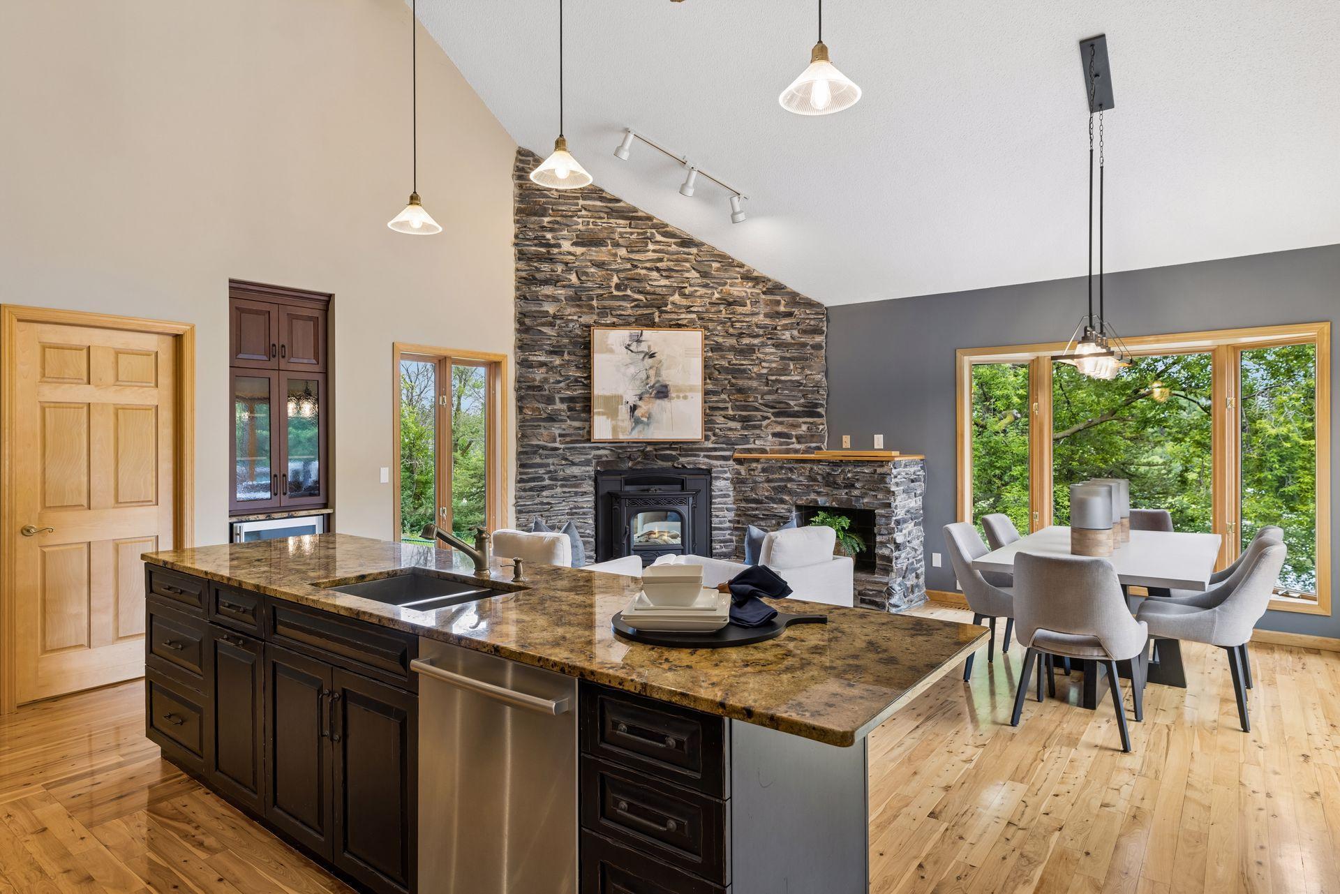 Eat-in dining area features patio doors leading to deck, and bay window overlooking the lake and backyard.