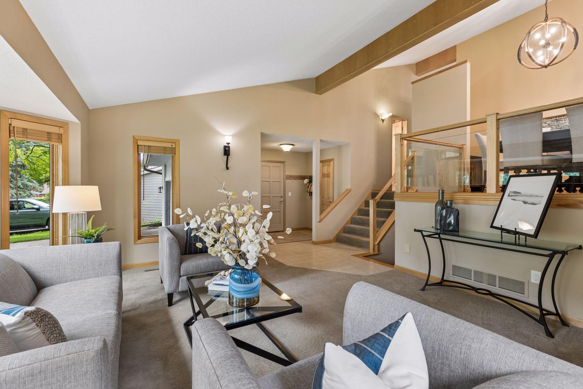 Front foyer features large walk-in coat closet, and access door to spacious 2+ car heated and insulated garage with bonus loft storage.