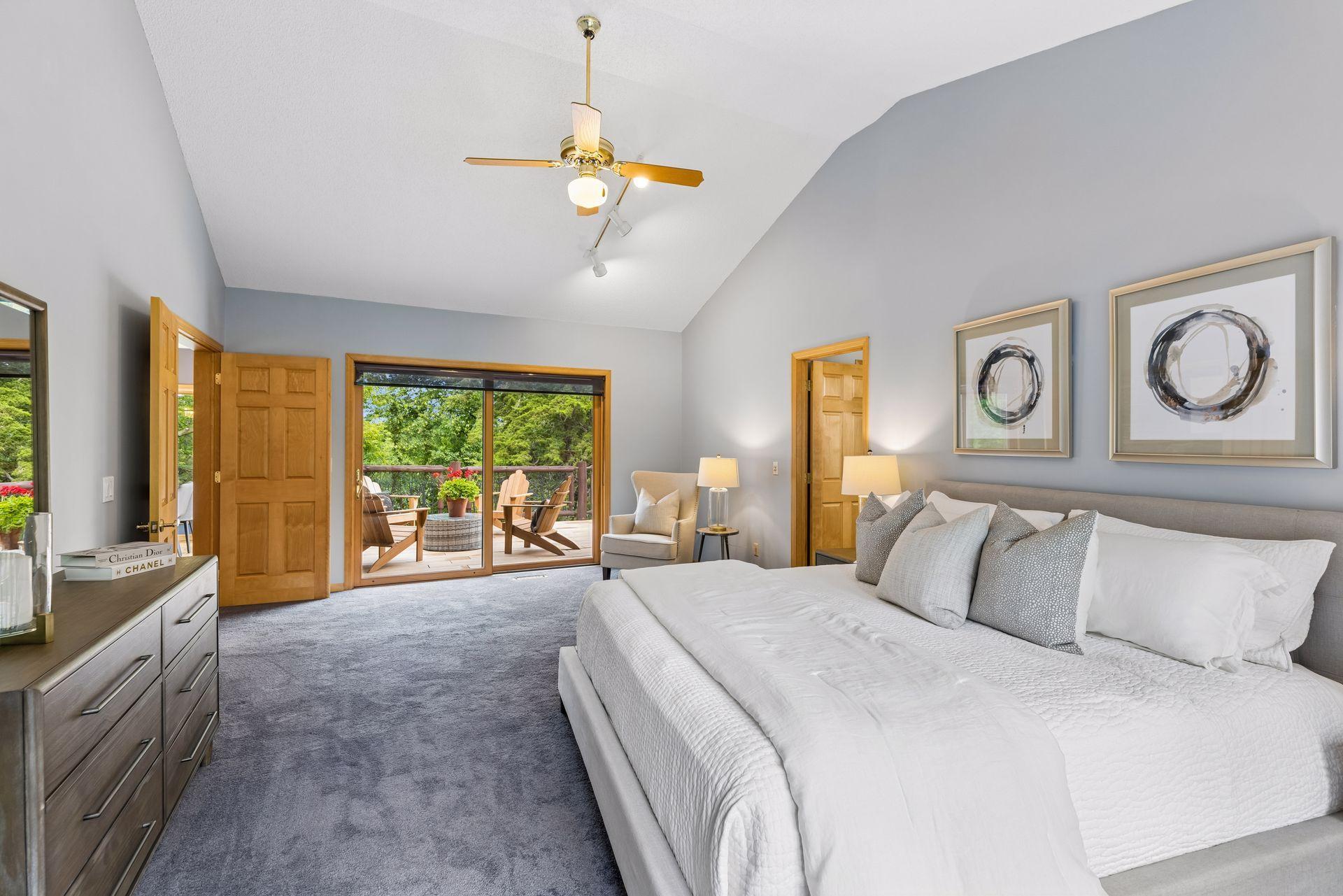 Primary bedroom to deck view. Wake up and enjoy coffee on the deck in the morning, watch the wildlife pass by.