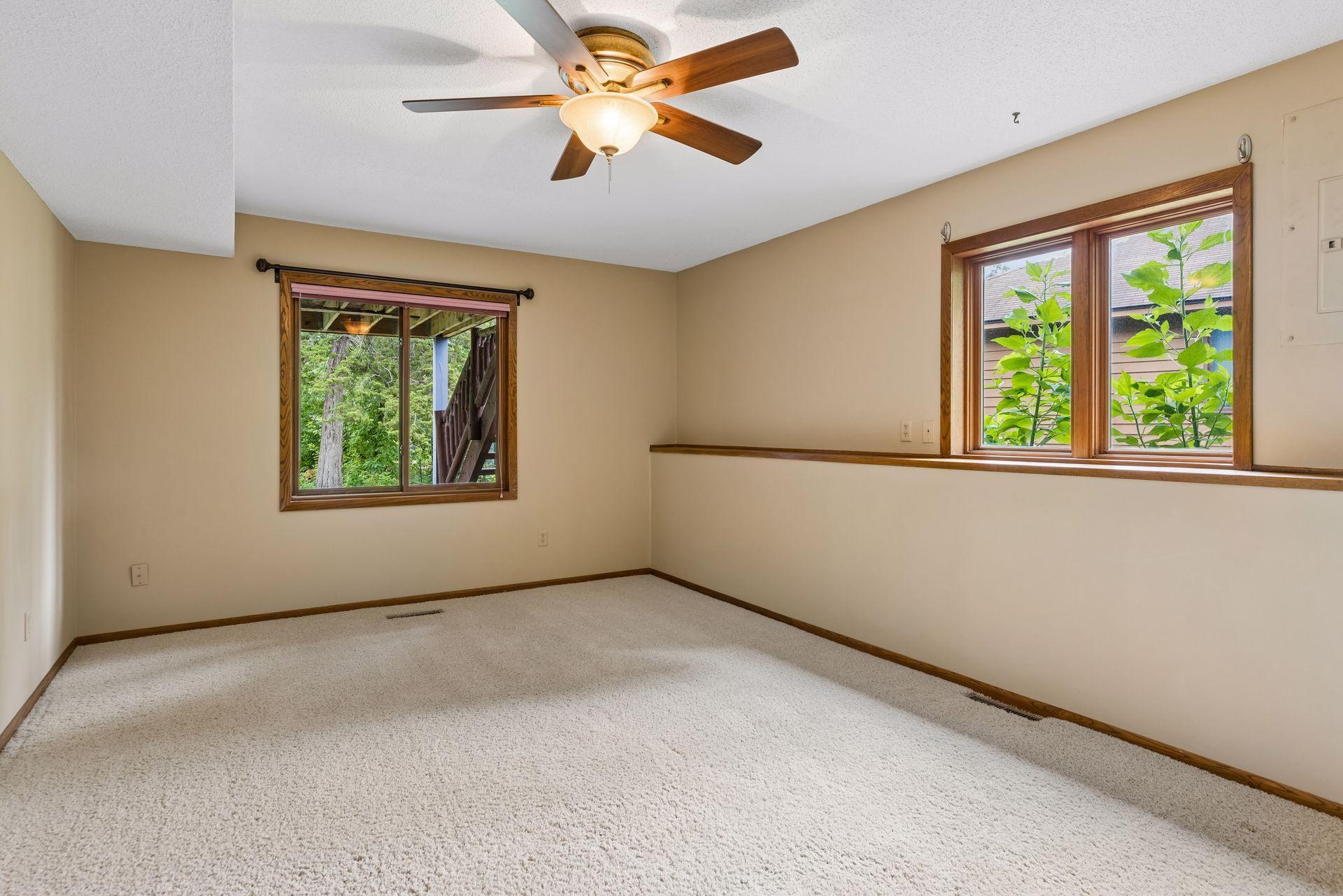 3rd bedroom with dual closets and walk-through doorway to bathroom.