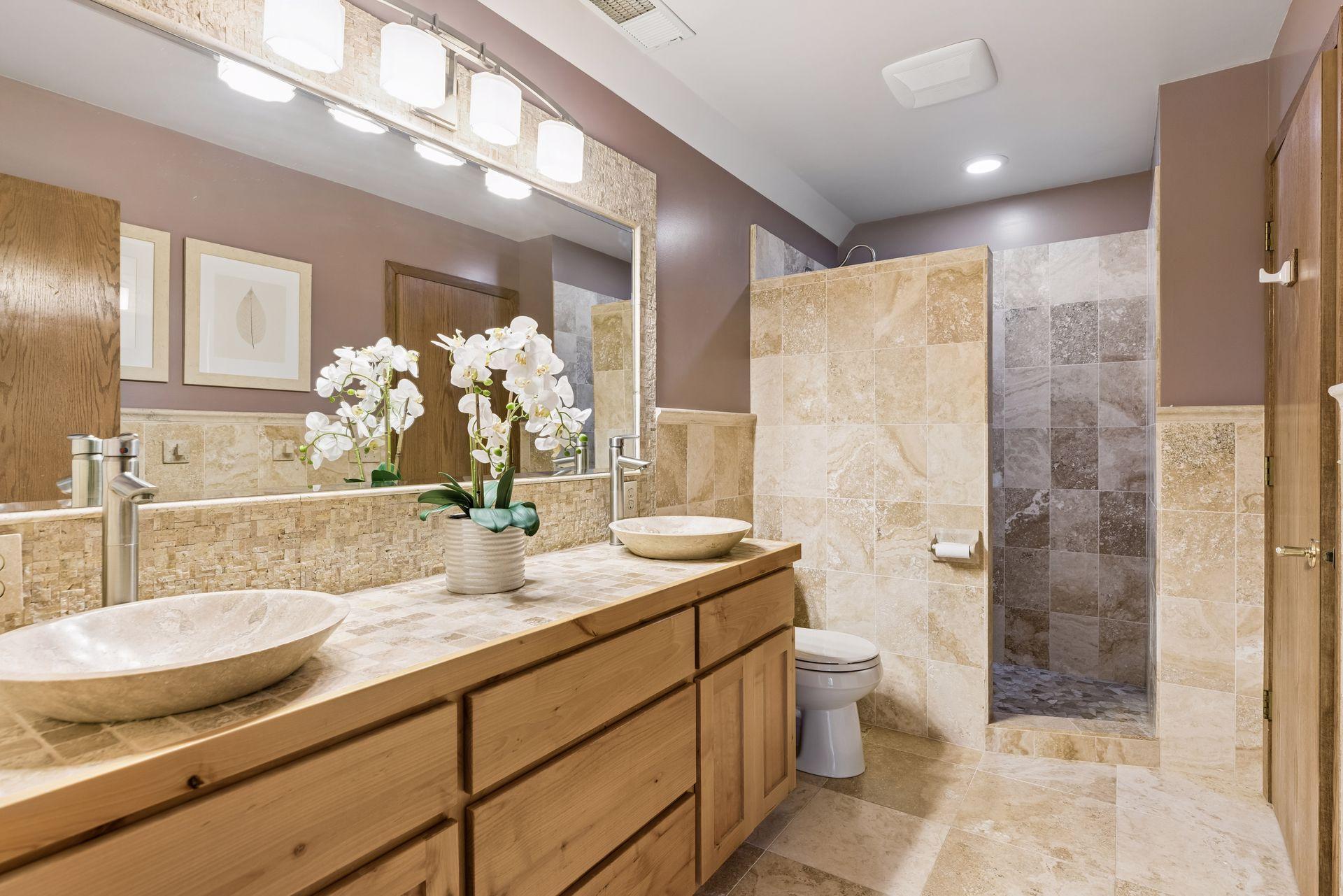 Lower level bathroom has two doors - one for the hallway, the other a walk-through doorway from the 3rd bedroom.