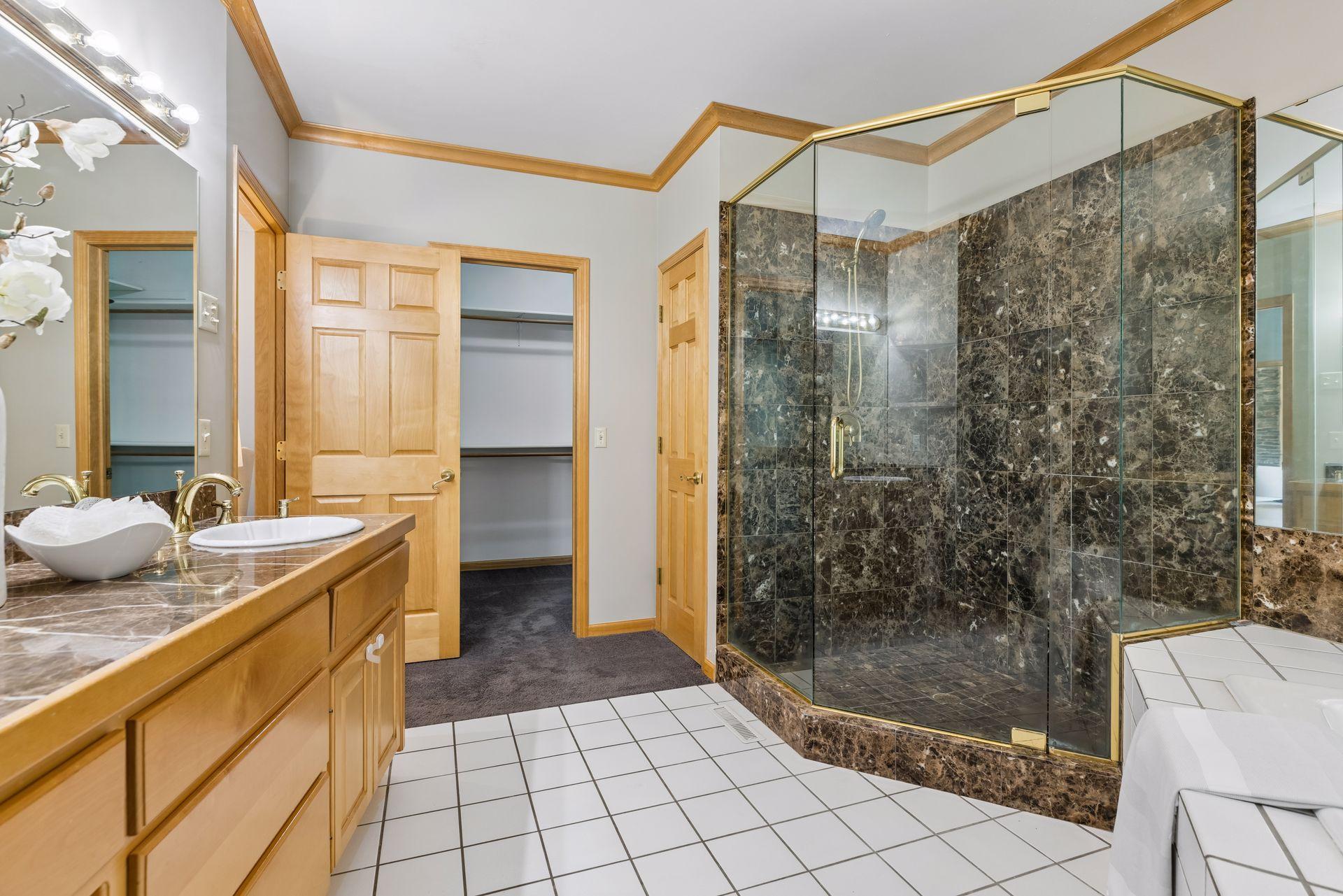 Adjacent to the primary bathroom is the walk-in closet.