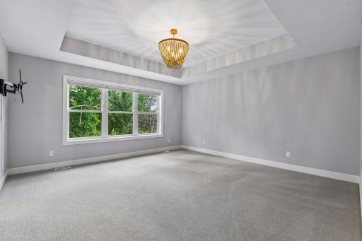 Primary Bedroom overlooks private backyard