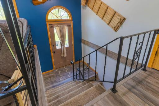 Open Stairway leads to door and the lower level