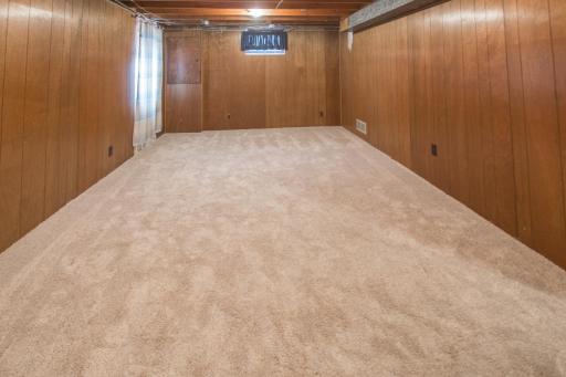 Lower level family room with egress window - could be a 4th bedroom