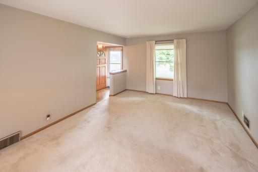 Main floor living room looking towards the entry