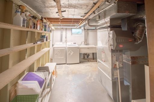 Laundry room with built-in shelving