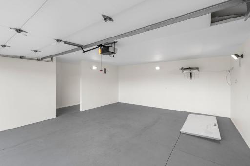 A view inside the finished, insulated, heated detached garage with dedicated storage rooms.
