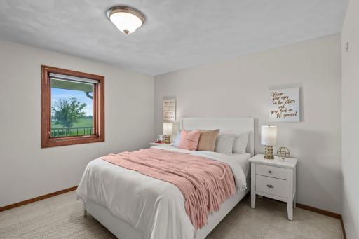 Located next to Bedroom Two, Bedroom Three features premium Italian tile flooring, a spacious closet, and a front-facing view, with convenient access to the nearby full bathroom.