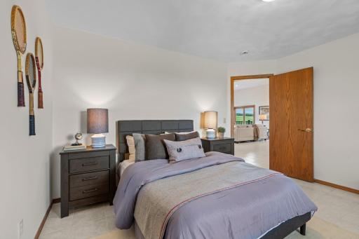 Bedroom Two, located on the main level, features premium Italian tile flooring, a generous closet, and a front-facing viewâjust steps from the shared full bathroom.