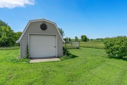 The property also includes two large outdoor storage sheds, perfect for housing tools, equipment, and seasonal items.