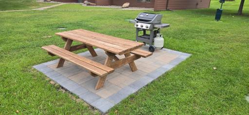 Enjoy some grilling on the new paver patio's and gas grills that look out over Bay Lake.