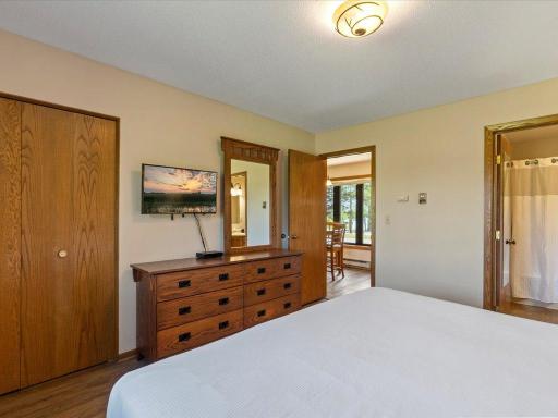 Another view of the main floor bedroom and a peak into the full bath. Nice sized bi-fold closet.