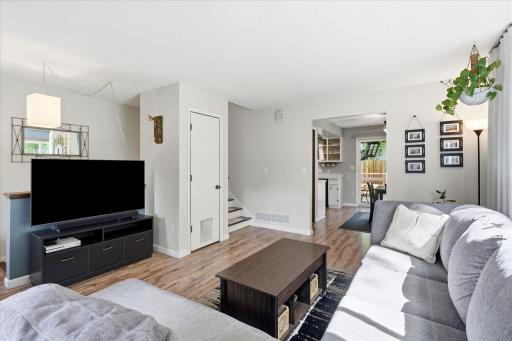 Step inside to a bright and inviting foyer featuring decorative glass entry doors, neutral finishes, and durable flooring. The welcoming entry offers a seamless introduction to the home's comfortable living spaces.