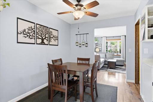 The bright dining area offers the perfect space for everyday meals and casual entertaining. A large patio door fills the room with natural light while providing convenient access to the outdoor deck.