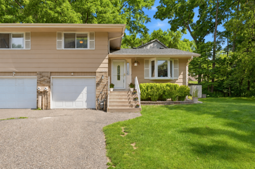 Welcome home to this well-maintained twin home featuring attractive curb appeal, an attached garage, mature landscaping, and a welcoming front entry. The neutral exterior palette and manicured lawn create a warm first impression.