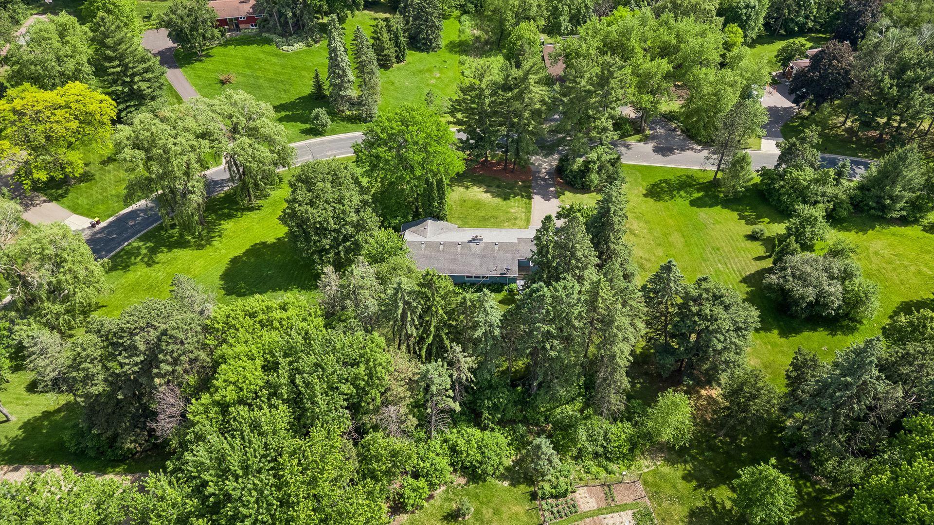 Exceptional privacy provided by mature trees and spacious acreage