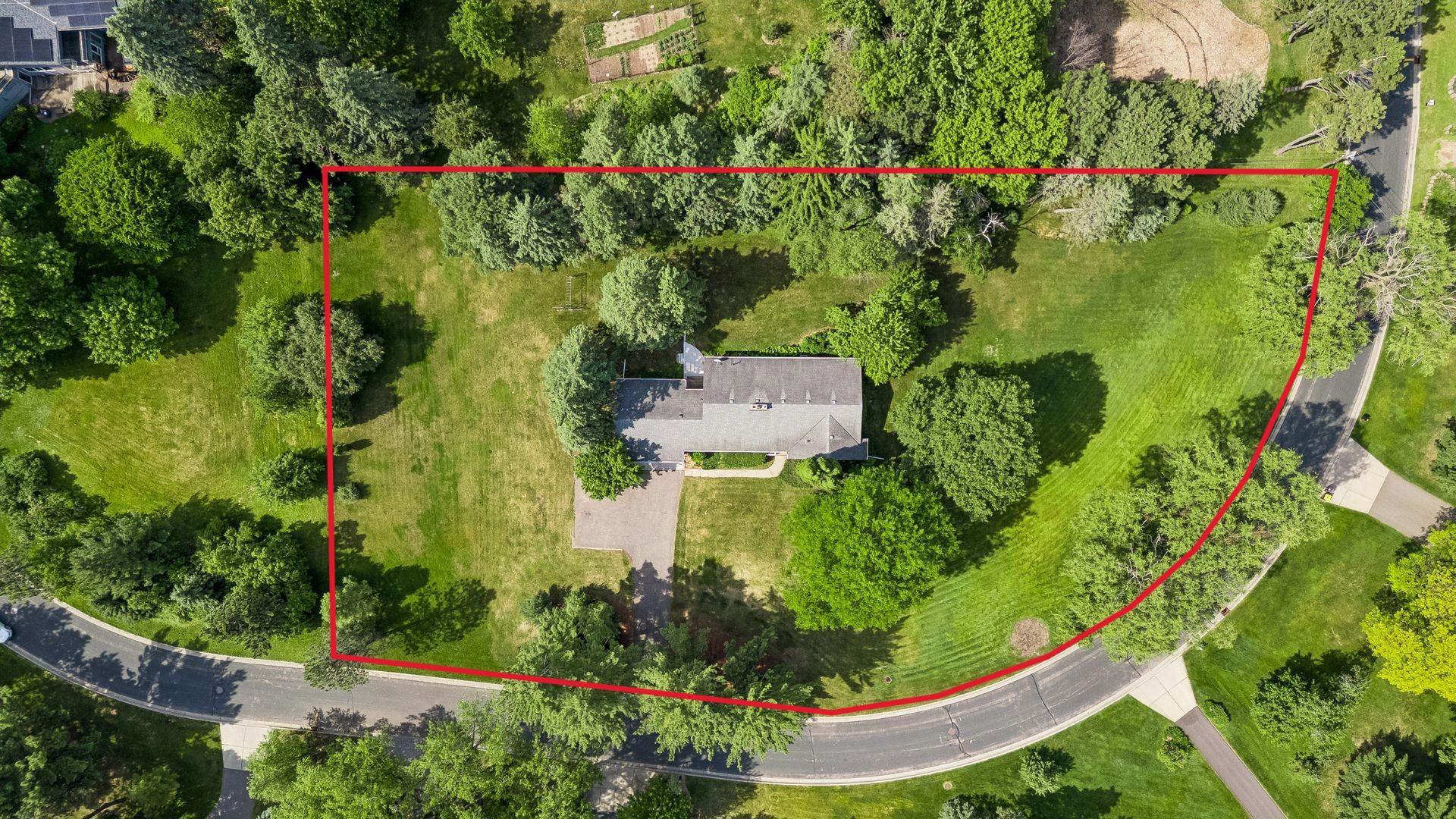 This home is set on a breathtaking 1.29-acre property. (Lot lines depicted are approximate and for illustrative purposes only)