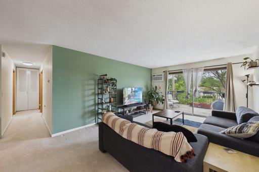 Bright natural light lit room overlooking your oversized deck.