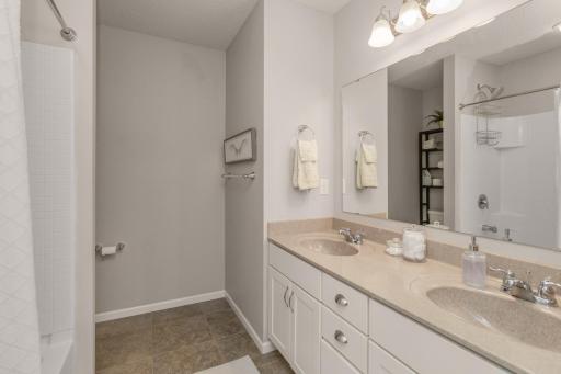 Full bath with dual vanity makes for a peaceful morning routine.
