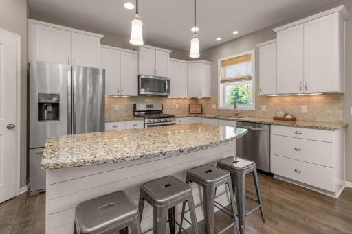 Pull up a stool at this huge granite island!