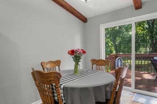 Dining Area Just off the Kitchen and Sliding Doors Leading out to the Deck
