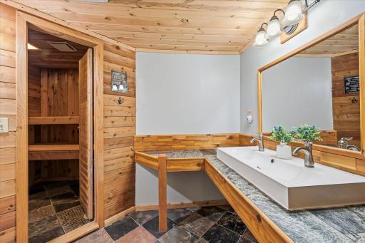 Bathroom features a sauna and tiled walk in shower.